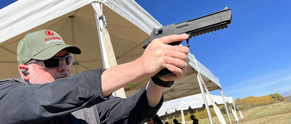 Joshua Swanagon shooting a Desert Eagle pistol.